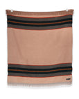 The S&A Blanket by Faire is a vintage-inspired rectangular beige throw with black and red stripes near the top and bottom and fringe detailing, shown laying flat against a white background.