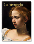 Book cover for "Caravaggio. The Complete Works" by Ingram Book Company, showcasing a detailed close-up of a classical Italian painting—a woman with curly hair, a pearl earring, and a serious expression in Caravaggio’s masterful style.