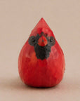 Red hand-painted carved wood bird with black accents, cardinal-inspired decor by Faire for Bungalow Furniture & Accessories.
