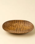 Round mango wood dish by Faire, Terrain Carved Dish S, ideal for eco-friendly decor or as a small serving plate.