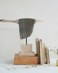 Goose sculpture by Creative Co-op displayed on a stand with vintage books and yellow dried flowers for a cozy accent.