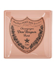 The Faire Dom Perignon Rose Glass Tray is a handcrafted piece featuring a large pink "Dom Pérignon Rosé, 3 Liters, Brut" label design with decorative flourishes and a central star.