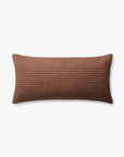 The Rust Pillow 12x27 by Loloi Rugs features a rectangular shape in brown with a subtle quilted grid pattern and a soft cotton insert, displayed against a plain white background.