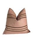 The Rennah Collective Clementine Pillow 22x22 features a pink, woven fabric with dark horizontal stripes, a subtly textured surface, and a modern minimalist design, shown against a white background.