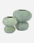 The Import Collection’s Connolly Vase set features two handcrafted ceramic vases in light green with textured glaze, each irregularly shaped and rounded, including a small and a large piece with narrow top openings.