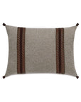 The CRISTOBAL FAUX LEATHER pillow by Eastern Accents is rectangular and gray, featuring two vertical woven leather-like bands with intricate details near the center and small brown fabric loops on each corner.
