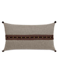 Beige pillow with brown leather strip, brass studs, and corner ties by Eastern Accents, Cristobal collection.