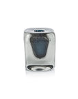 An elegant Zodax glass paperweight with a rounded rectangular shape and a textured dark metallic form inside—perfect as home decor or paired with the CH-7277 Crystal Bloom Vase.
