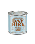 A light blue tin labeled "G&W Soy Candle" with copper-colored text and scent notes, 6 oz net weight, 45-hour burn time, from the Happy Place Collection by Faire, is shown on a white background.