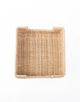 The Faire Rattan Bev Napkin Tray is crafted from natural rattan with a tightly woven pattern and slightly raised edges, making it ideal for use as a handcrafted cocktail napkin tray, displayed against a plain white background.