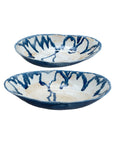 The Import Collection’s Demario Bowls are shallow stoneware pieces with irregular rims, a cream base, and abstract blue streaks. Their handmade look makes these blue and white bowls perfect as artistic decor for any room.