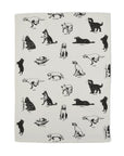 Cotton tea towel with black dog illustrations from Fishes Eddy, 20x28 inches, machine washable.