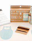 The Faire Horned Owl Embroidery Kit includes owl-patterned fabric, embroidery floss, stuffing, an instruction sheet, and a finished embroidered owl doll—everything you need to create your own horned owl design.