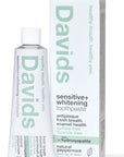 A tube and box of Faire Davids Toothpaste, sensitive + whitening, fluoride free, with hydroxyapatite and natural peppermint for antiplaque, fresh breath, enamel health; USDA certified biobased and in a recyclable metal tube.