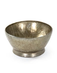 The Zentique Edgard Bowl /Antique Gold features a simple round shape with a slightly flared rim, small pedestal base, and a hammered textured surface for a decorative, reflective centerpiece.