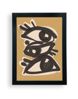 “Abstract line art eyes” by Faire is a limited-edition framed poster featuring three black, stylized eyes stacked on a tan background with bold brushstrokes and thick lines in a sleek black frame.