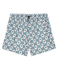 The Rover Short by The Great Inc. are light blue, durable, lightweight shorts with an elastic waistband, black drawstring, and a white daisy print—ideal for versatile outdoor wear.