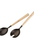 The Indaba Maple Salad Servers feature maple wood handles and black, speckled metal heads—a solid spoon and a forked spoon. These stylish utensils make a thoughtful hostess gift for any gathering.