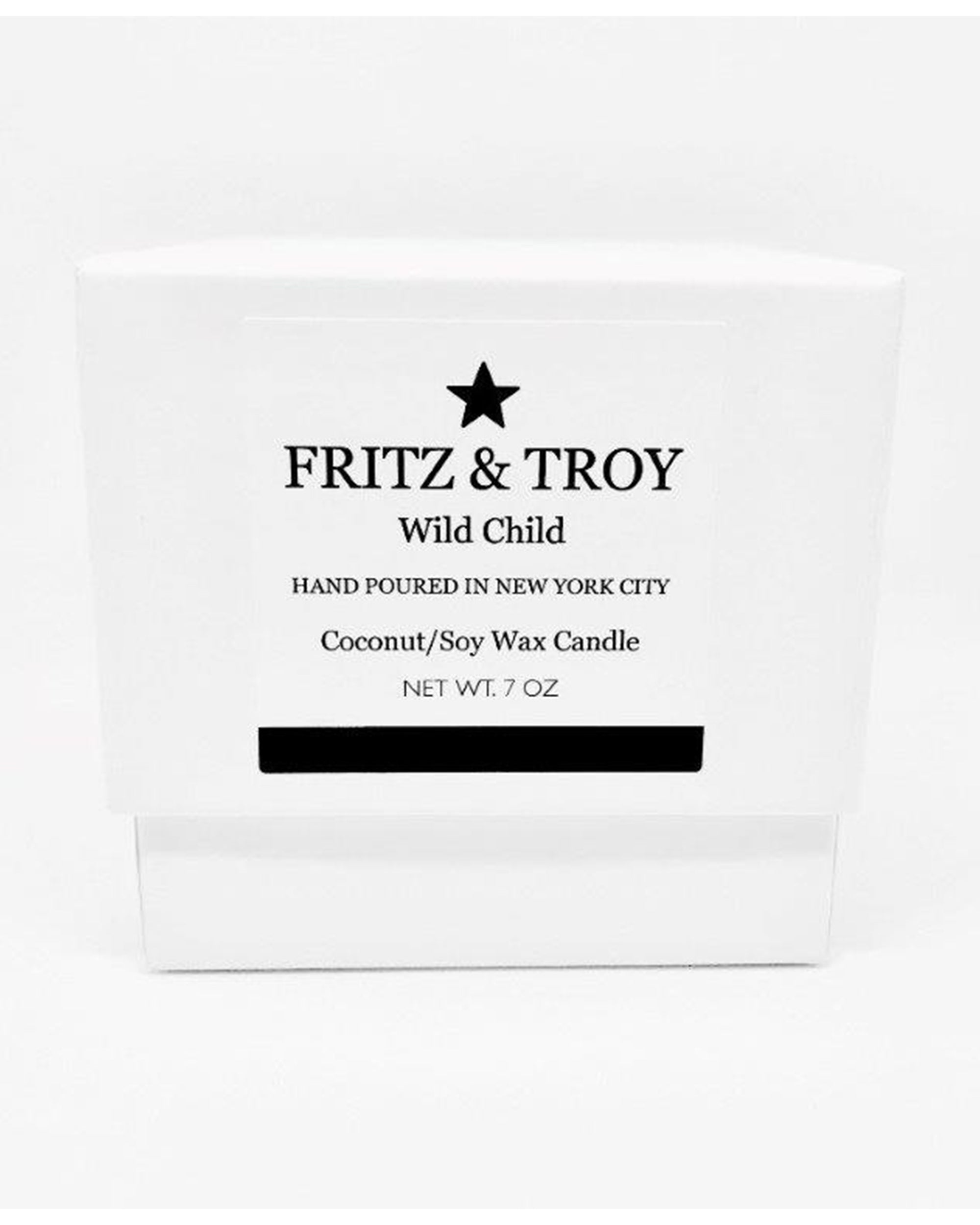 A white candle box labeled "Fritz & Troy Wild Child" holds a hand-poured coconut/soy wax candle made in NYC, with mandarin, jasmine, and amber notes. "NET WT. 7 OZ" is printed boldly on the front.