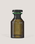 The Nue Co's Functional Fragrance 50ML features a brown glass bottle with a black cap, offering a minimalist design that suggests its anti-stress benefits. Its elegant and modern aesthetic stands out against a plain light background.