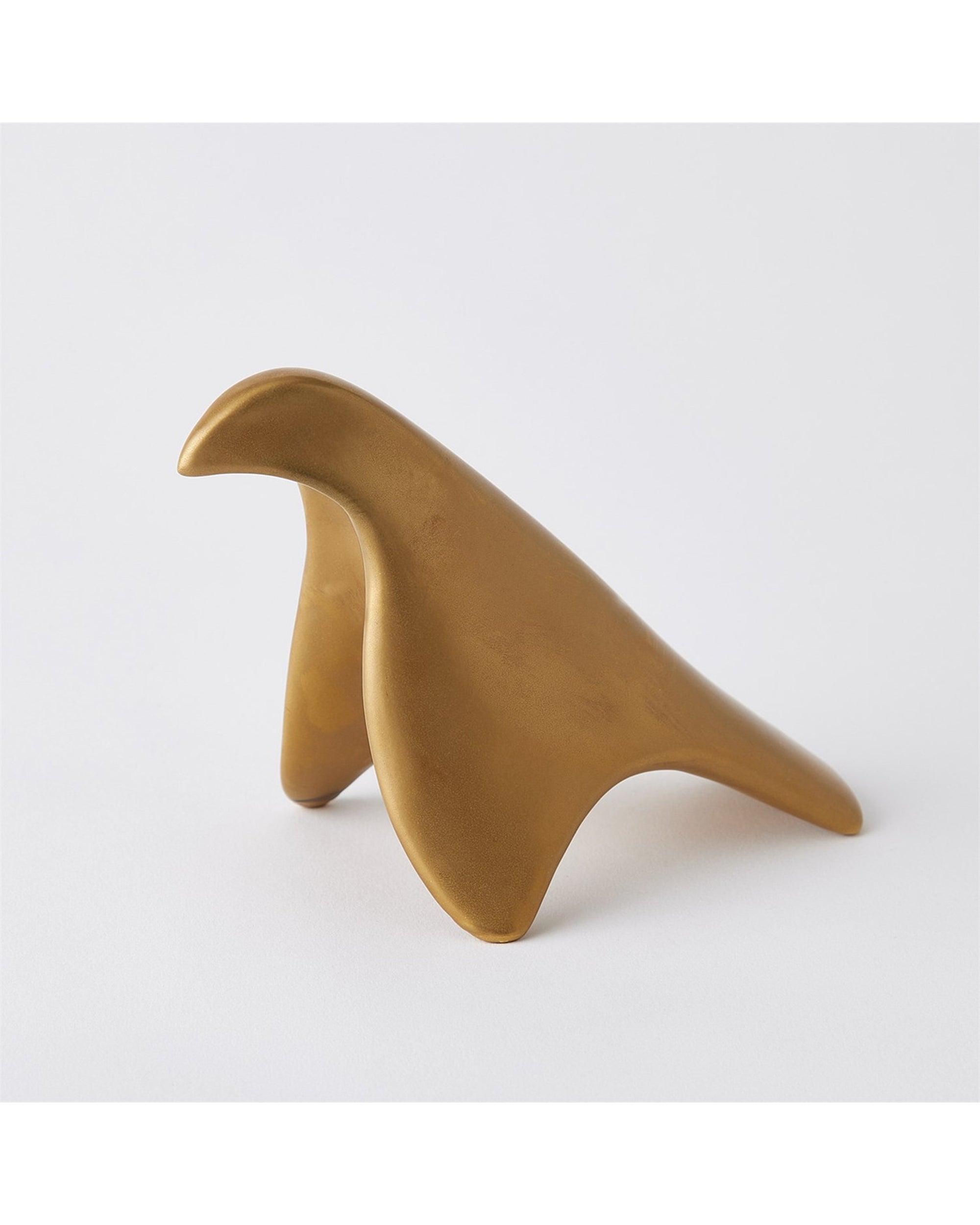 The Les Animaux Colombe Gold by Global Views is a smooth, abstract bird sculpture featuring simplified, rounded shapes and a gold finish, shown against a plain white background.