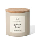 The beige 14oz Golden Hour candle by Faire features a wooden lid, a white label, and is made from a hand-poured soy wax blend infused with passion fruit fragrance.