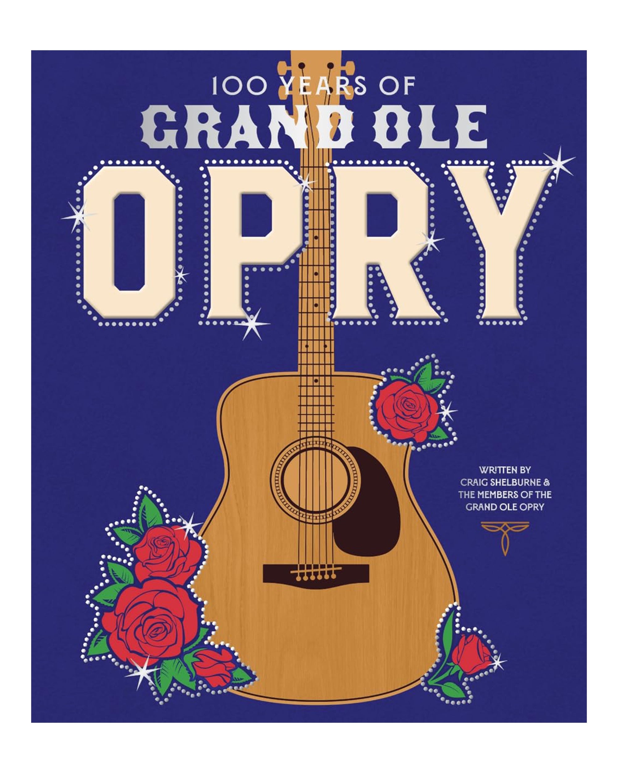 Book cover for "100 Years of Grand Ole" by Hachette Book Group, celebrating a century of country music with a bold acoustic guitar, red roses, and blue background. Title in striking white and gold above the guitar.