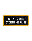 The Oxford Pennant Great Minds Overthink Alike 10x24 camp flag features black, cream, and gold colors, a yellow border, white "GREAT MINDS OVERTHINK ALIKE" text, and reinforced corners with metal grommets.