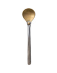 The Brass Spoon Alum Handle by Bloomingville features a gold-toned, round brass bowl with a matte hammered aluminum handle, shown against a white background.