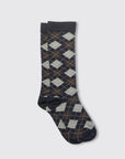 A pair of Harlekin Socks by Maria La Rosa, featuring a black, gray, and brown argyle pattern, is laid flat on a white background. Made in Italy.