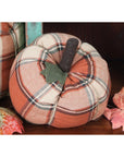 The Faire Pumpkin features orange and cream plaid cloth with a dark brown stem and green leaf—an ideal fall accent or farmhouse decor ornament.