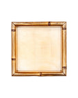 A square bamboo picture frame with a light beige backing, seen from above on a white surface, offers tabletop décor similar to the elegant Gold Leaf Cocktail Napkin Holder by Caspari, Inc.