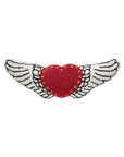 Red heart pillow with white wings and yellow dots, wool-hooked by Faire, whimsical accent for living room or bedroom.