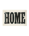 The Faire Home Block Glass Tray features a rectangular design with a white background and bold, black "HOME" lettering in vintage typography for a timeless look.