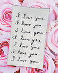 A romantic Ben's Garden Tray 4"x6" features a white card with "I love you." written seven times in black cursive over pink roses, handcrafted using the French decoupage technique.