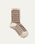 The Iceland Socks by Maria La Rosa are cream women’s mid-calf socks with red, black, and beige check plaid, beige toes, heels, cuffs, and slim sole stripes. Made in Italy for a blend of classic style and comfort.