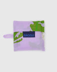 The Baby Baggu by Baggu is a folded reusable shopping bag made from recycled ripstop nylon, featuring a purple and green abstract pattern, a blue BAGGU label, and set against a white background.