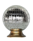 The Blue Ocean Traders Wunderkammer Orb features a reflective, spherical antique-silver glass with a grid pattern, sitting on a round metallic base. Its vintage finish adds a striking mirrored accent to any space.