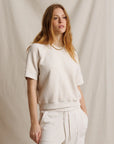 Cream Perfectwhitetee Kennedy SS Crew Sweatshirt and joggers, relaxed fit, styled against a beige fabric backdrop.