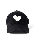 The Kerri Rosenthal Baseball Hat Heart Patch features a black design with an embroidered heart-shaped patch on the front, shown against a plain white background for a stylish, modern look.