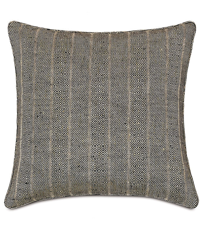 The Kimahri pillow by Eastern Accents features textured fabric with alternating vertical stripes of geometric diamond patterns in black, white, and beige. Ethnic-inspired and finished with a subtle piped edge.
