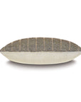 The Kimahri pillow by Eastern Accents is rectangular with a beige bottom and a patterned top featuring black geometric diamonds and greenish stripes, shown in side view against a white background.