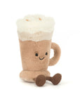 The Jelly Cat Inc. Amuseables Latte is a soft plush toy shaped like a mug, featuring a frothy top, smiling face, and dangling brown legs, sitting upright on a white background.