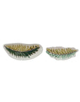 The Creative Co-op Stoneware Bowl Assorted set features two leaf-shaped bowls with green and yellow patterns, food safe and sized large and small. Both dishes are pictured on a white background.