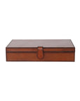 The Creative Co-op Leather Box Snap Closure is a closed rectangular box in cognac leather with stitched edges and a snap closure, shown on a white background.