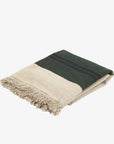 Beige and dark green striped throw with black accent and fringe, Libeco Home Omaha Stripe, shown on white background.