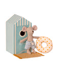 Maileg’s Little Brother/Beach Cabana features Little Brother Mouse in blue and white striped shorts with a dotted pool ring, standing by a striped beach hut—ideal for seaside-themed pretend play.