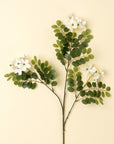 The Faire 1-9528 Locust Flower Branch features clusters of white blooms and green oval leaves against a pale yellow background—timeless faux decor perfect as an accent piece.