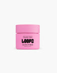 A small pink jar labeled "LOOPS Glow Lip Mask" from Faire, a nourishing lip care essential, is set against a plain white background.