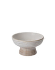 The Lorca Footed Bowl by Accent Decor features a wide, shallow white ceramic dish on a short cylindrical base with subtle beige and white stripes—perfect for home decor or displaying your favorite bowl fillers. Shown on a plain white background.